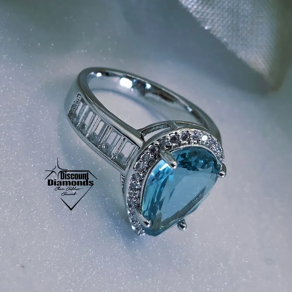 Aquamarine Cocktail Ring flanked by Round & Rectangular Cut Sapphire on 925